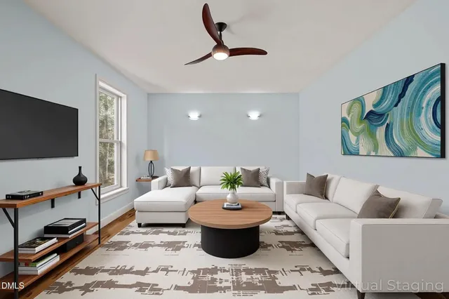a living room with furniture and a flat screen tv
