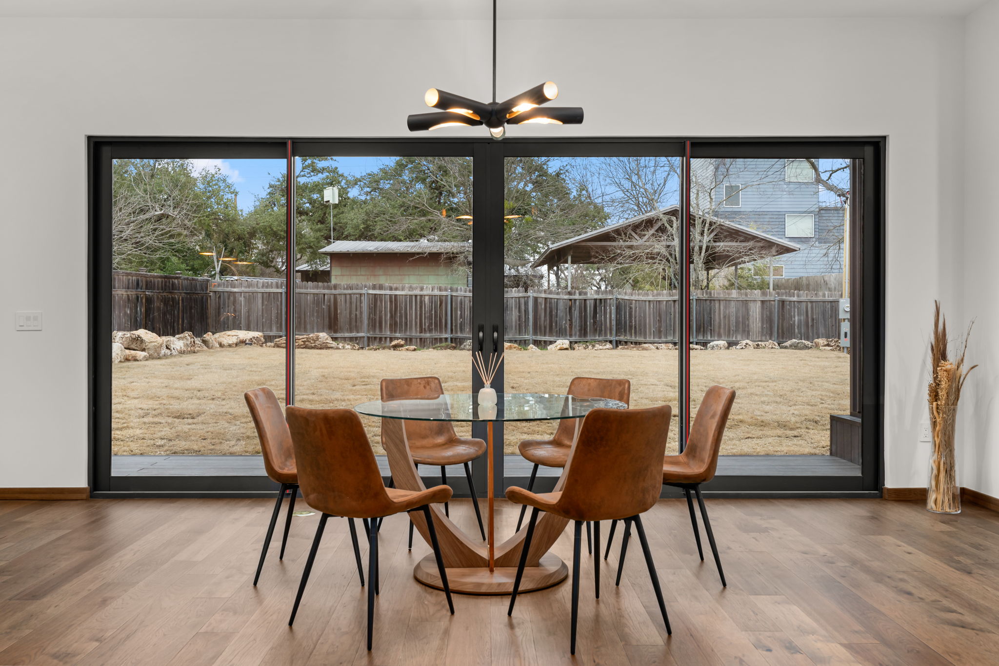 2915 Chisholm Trail Austin, TX 78734 - Photo 15 of 35 a view of a dining room with furniture large windows and wooden floor