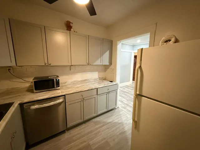 a bathroom with a shower and mirror