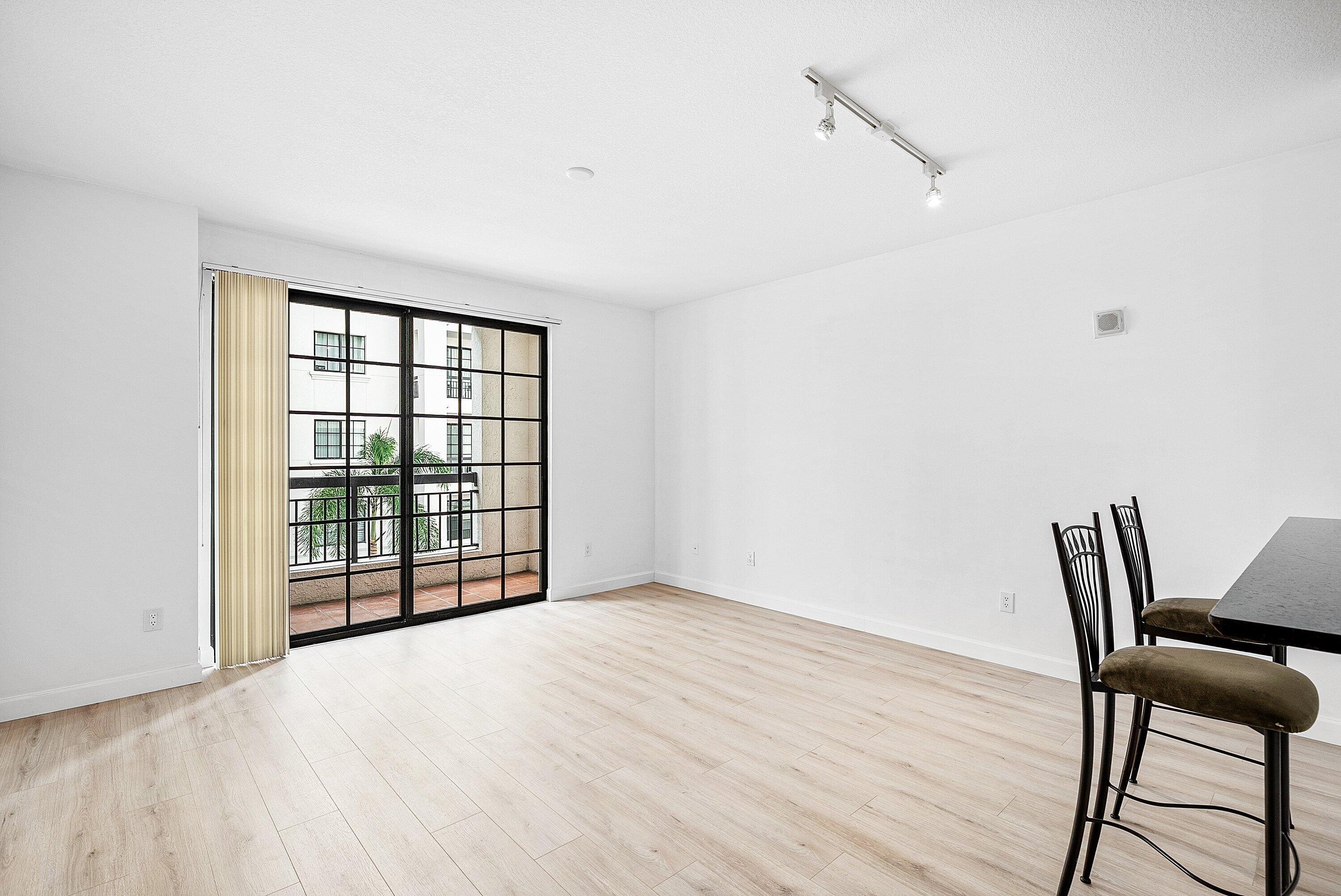 233 South Federal Highway, Unit 404 Boca Raton, FL 33432 - Photo 11 of 34 a view of an empty room with glass door