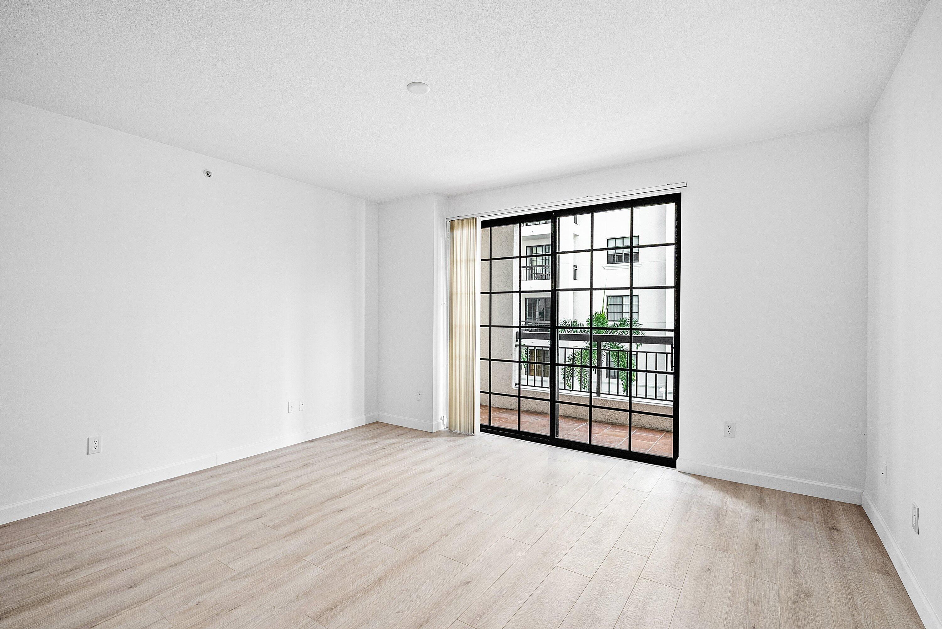 233 South Federal Highway, Unit 404 Boca Raton, FL 33432 - Photo 12 of 34 wooden floor in an empty room with a window