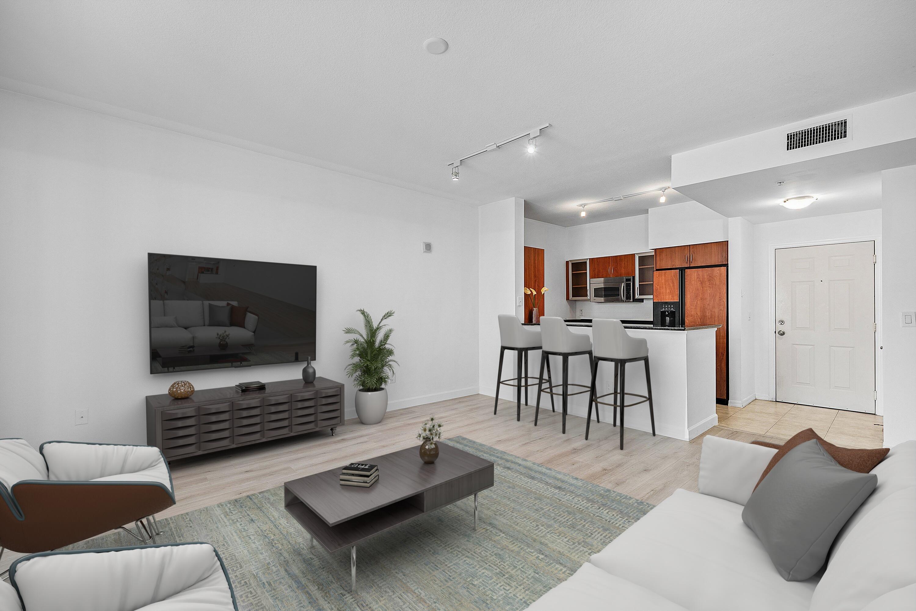 233 South Federal Highway, Unit 404 Boca Raton, FL 33432 - Photo 5 of 34 a living room with furniture and a flat screen tv