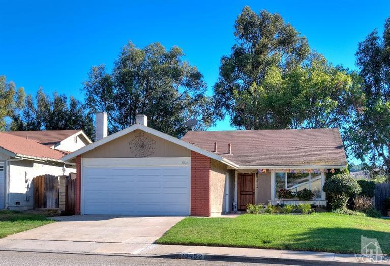 13452 East Quail Summit Road Moorpark, CA 93021 - Photo 1 of 15 a view of a big house with a small yard and large tree