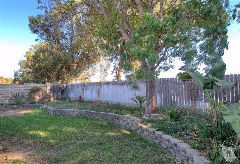 13452 East Quail Summit Road Moorpark, CA 93021 - Photo 14 of 15 a view of a backyard with plants and a large tree