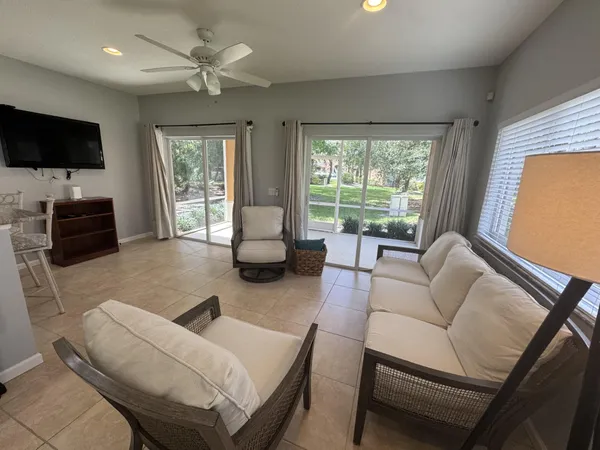 a living room with furniture and a large window