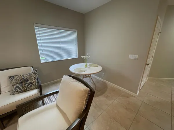 a large kitchen with a large window and stainless steel appliances
