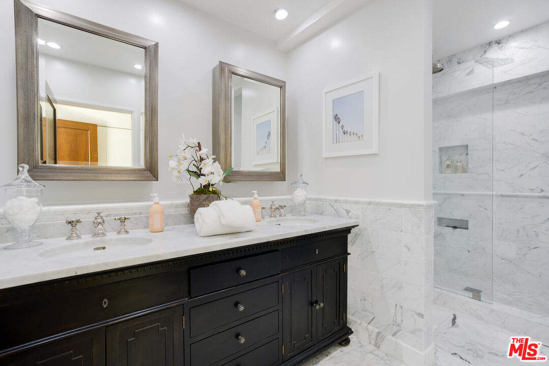1417 Queens Road Los Angeles, CA 90069 - Photo 14 of 25 a bathroom with a granite countertop sink mirror and double