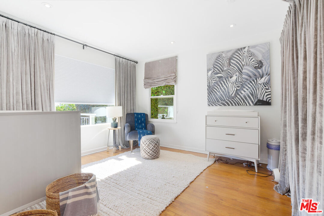 1417 Queens Road Los Angeles, CA 90069 - Photo 19 of 25 a bedroom with a bed and a window