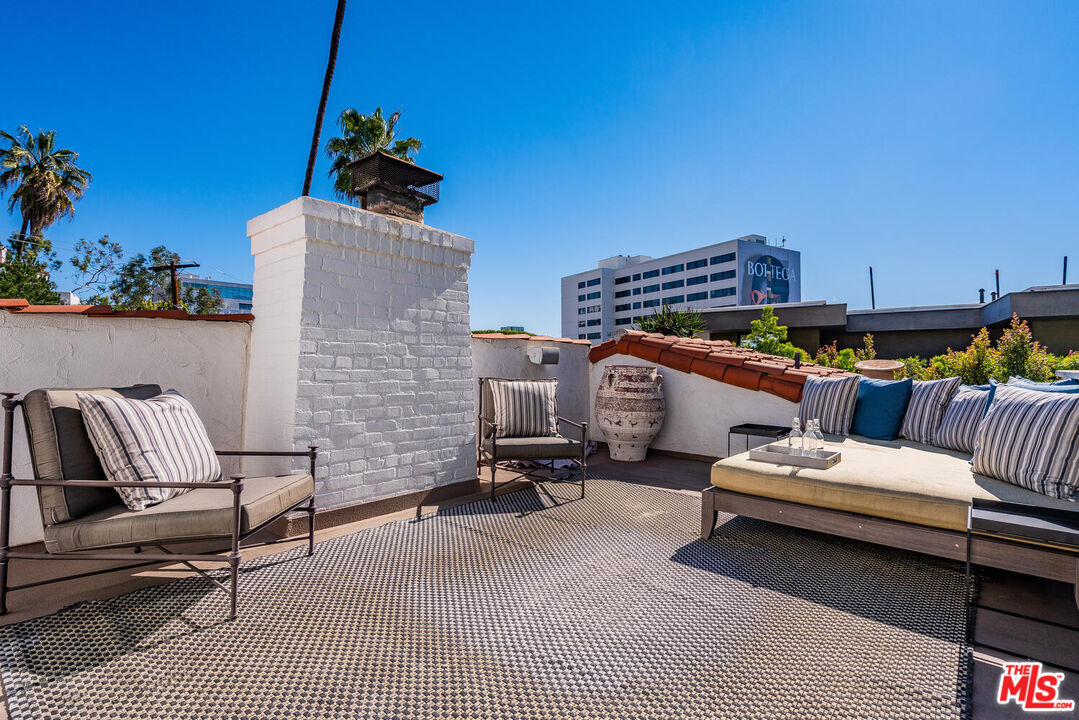 1417 Queens Road Los Angeles, CA 90069 - Photo 21 of 25 a outdoor space with patio the couches and a potted plant on the table