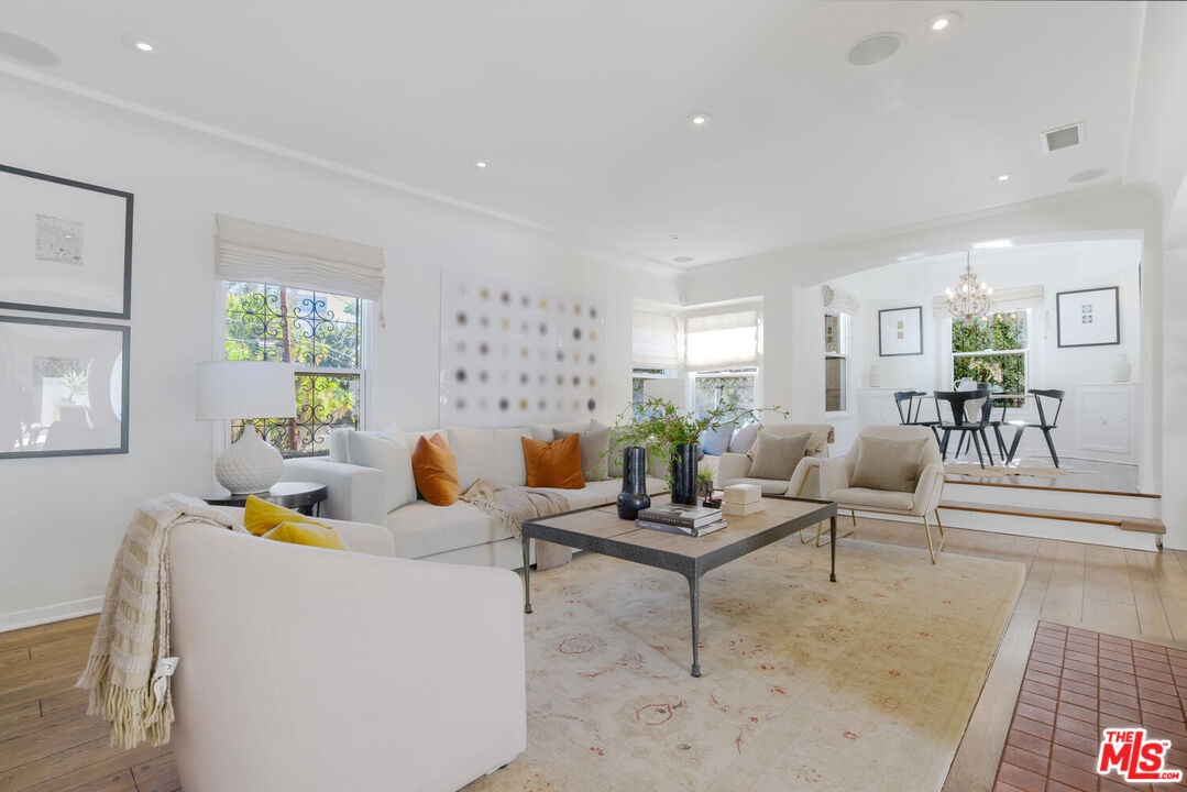 1417 Queens Road Los Angeles, CA 90069 - Photo 3 of 25 a living room with fireplace furniture and a rug
