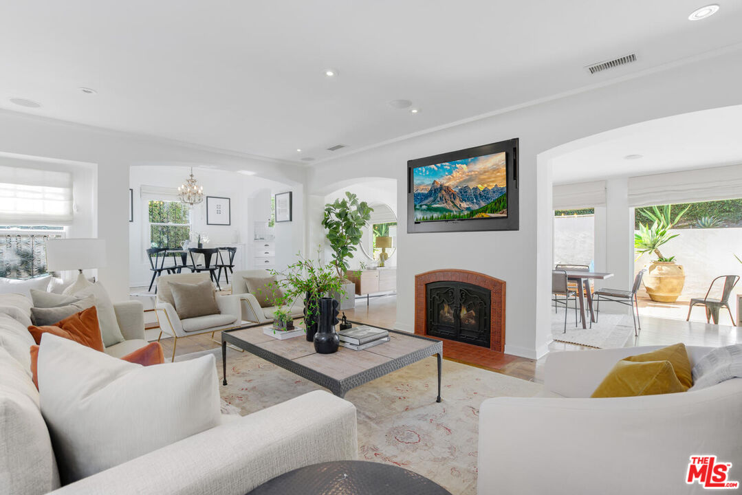 1417 Queens Road Los Angeles, CA 90069 - Photo 4 of 25 a living room with furniture fireplace and window