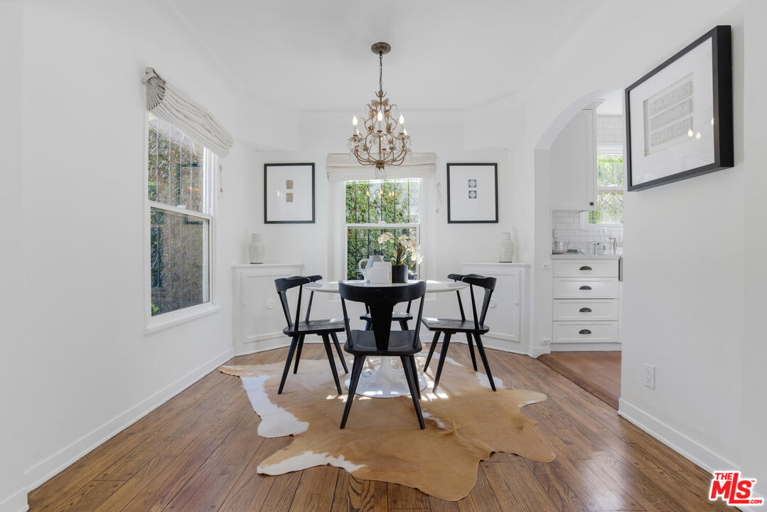 1417 Queens Road Los Angeles, CA 90069 - Photo 7 of 25 a view of a dining room with furniture window and wooden floor