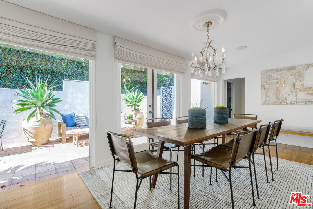 1417 Queens Road Los Angeles, CA 90069 - Photo 8 of 25 a view of a dining room with furniture window and wooden floor