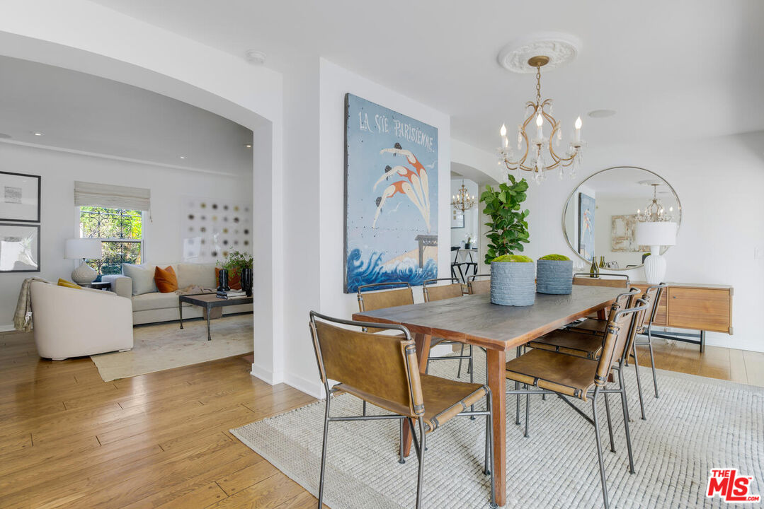 1417 Queens Road Los Angeles, CA 90069 - Photo 9 of 25 a view of a dining room with furniture and wooden floor