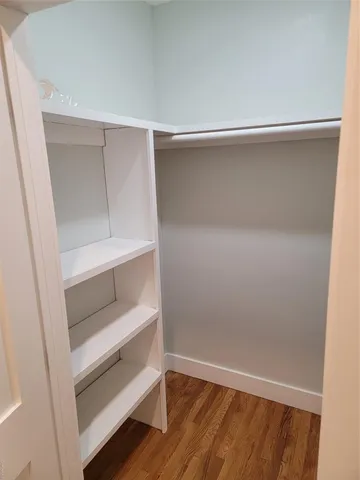 a view of an empty walk in closet