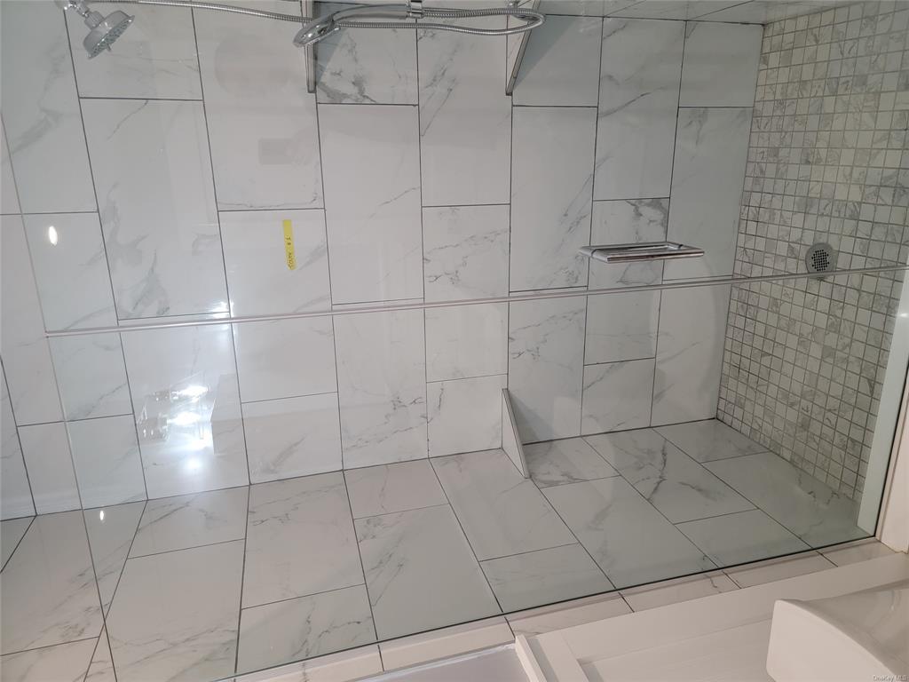 731 Broadway, Unit 2 Valhalla, NY 10595 - Photo 17 of 27 a bathroom with a shower