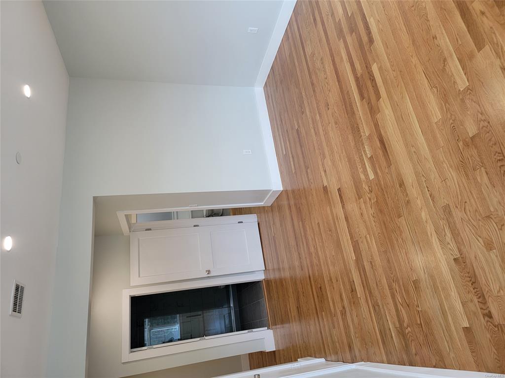 731 Broadway, Unit 2 Valhalla, NY 10595 - Photo 19 of 27 a view of a hallway with wooden floor