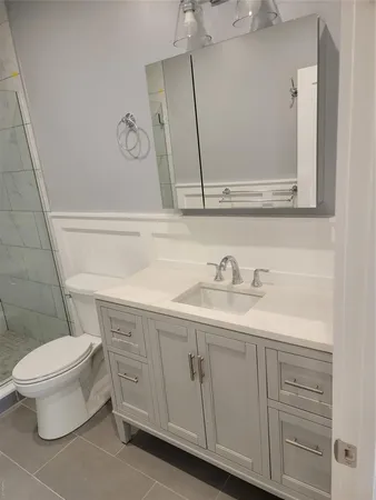 a bathroom with a sink and a toilet