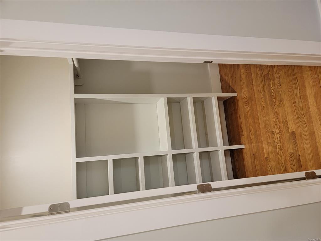 731 Broadway, Unit 2 Valhalla, NY 10595 - Photo 25 of 27 a view of walk in closet with empty racks