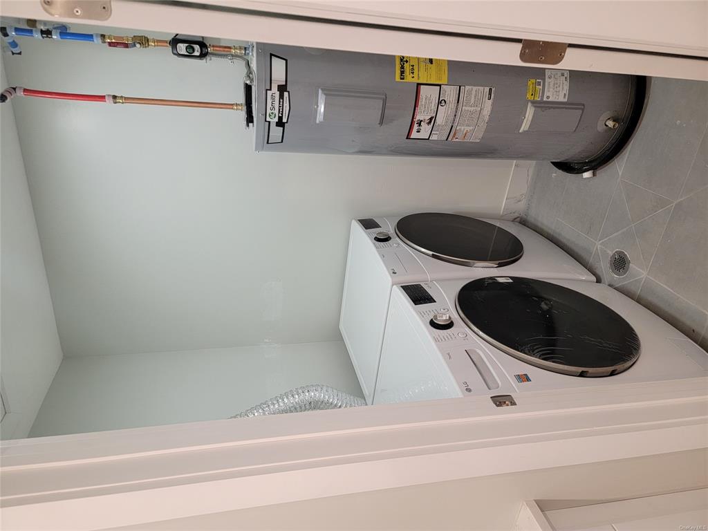 731 Broadway, Unit 2 Valhalla, NY 10595 - Photo 8 of 27 a utility room with dryer and washer