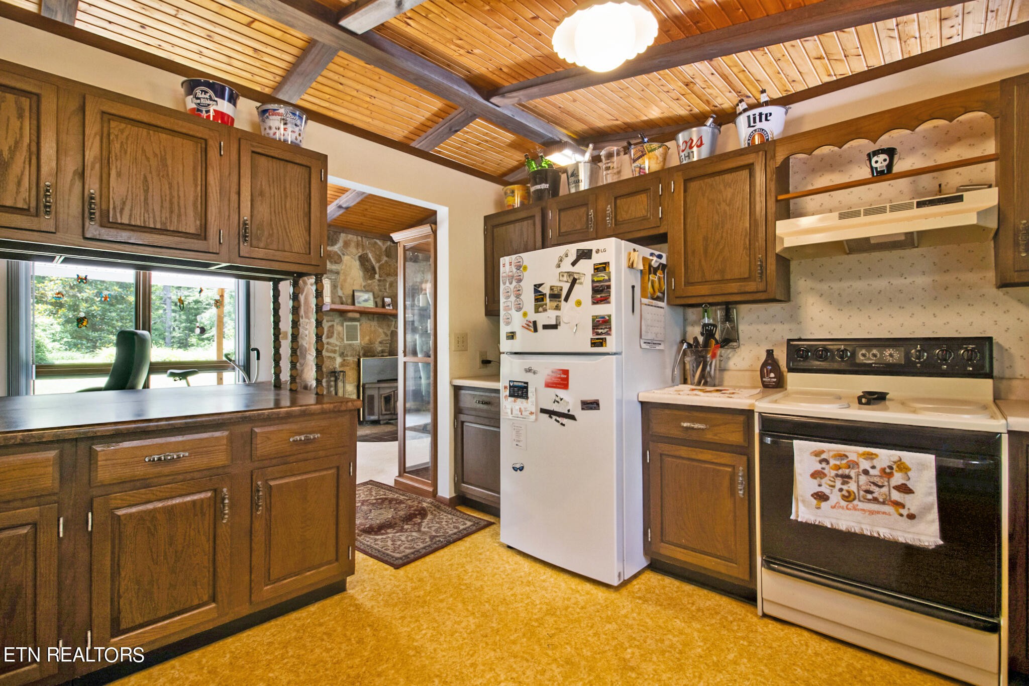 1620 Bell Road Crossville, TN 38571 - Photo 11 of 54 a kitchen with refrigerator and cabinets