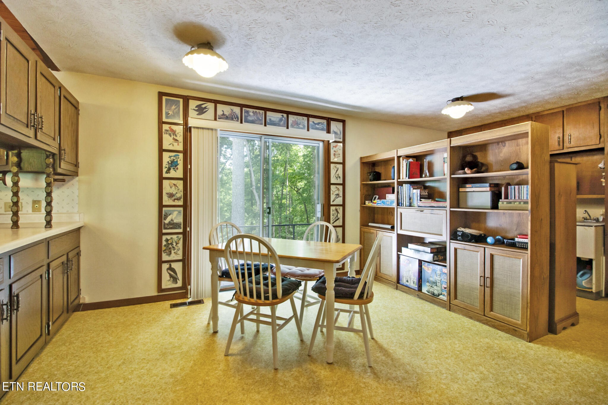 1620 Bell Road Crossville, TN 38571 - Photo 14 of 54 a dining room with furniture and a floor to ceiling window