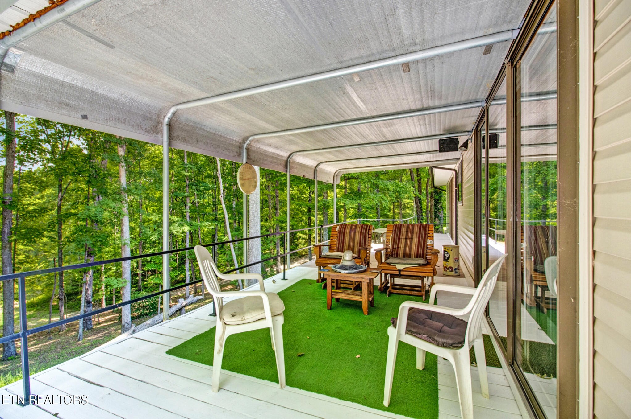 1620 Bell Road Crossville, TN 38571 - Photo 33 of 54 a view of a chairs and table in patio with a small yard