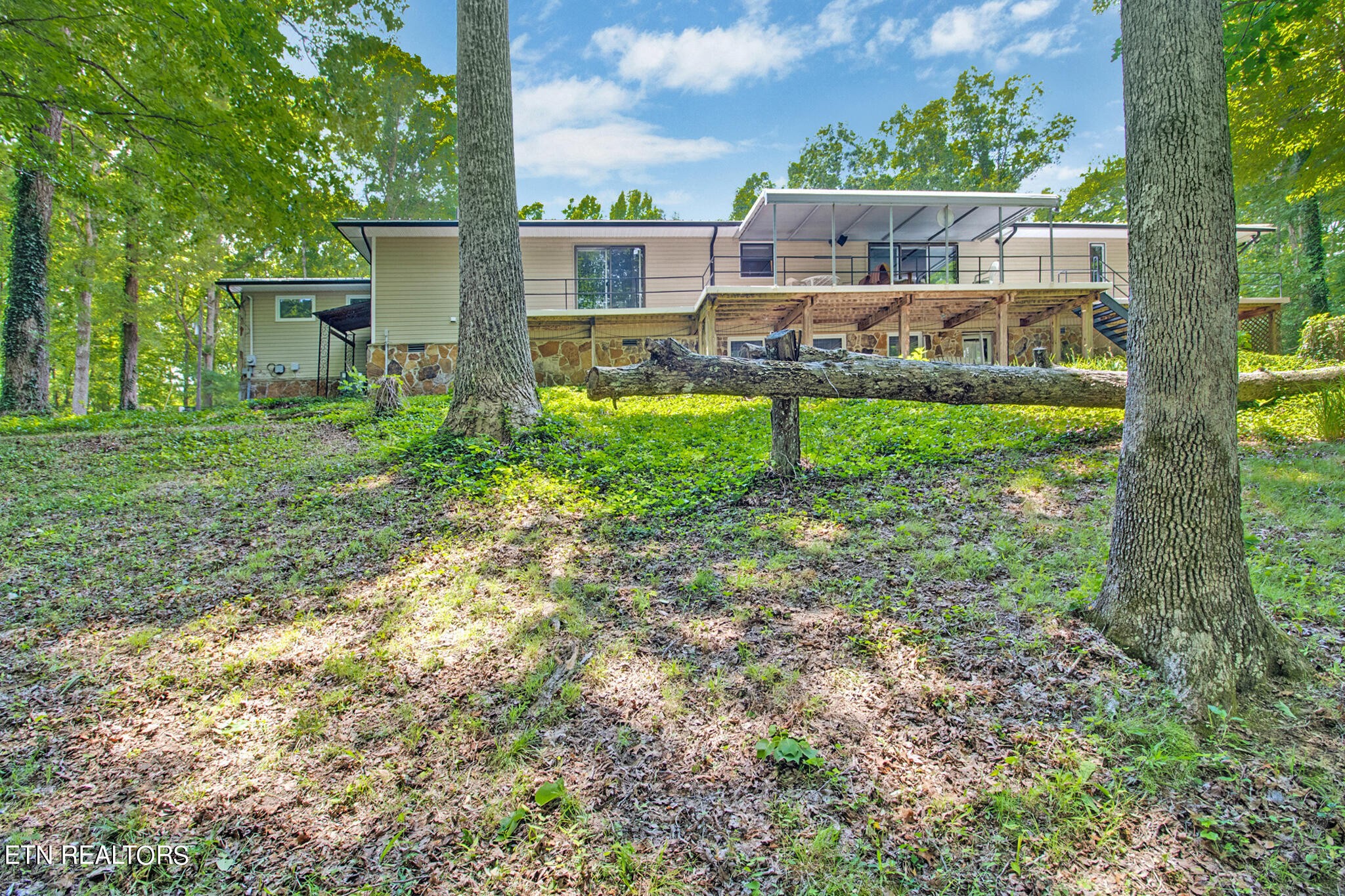 1620 Bell Road Crossville, TN 38571 - Photo 37 of 54 a front view of house with yard and seating area
