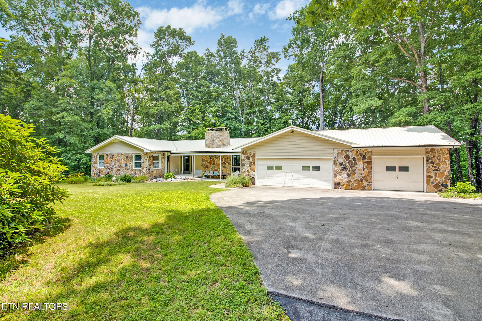 1620 Bell Road Crossville, TN 38571 - Photo 4 of 54 a front view of a house with yard and green space