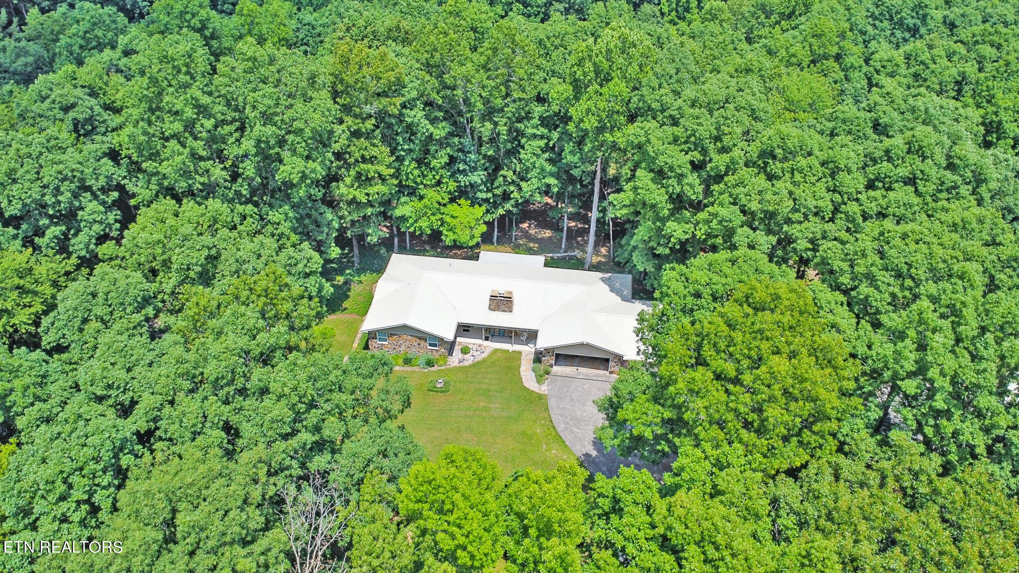 1620 Bell Road Crossville, TN 38571 - Photo 49 of 54 a view of a house with a yard and sitting area