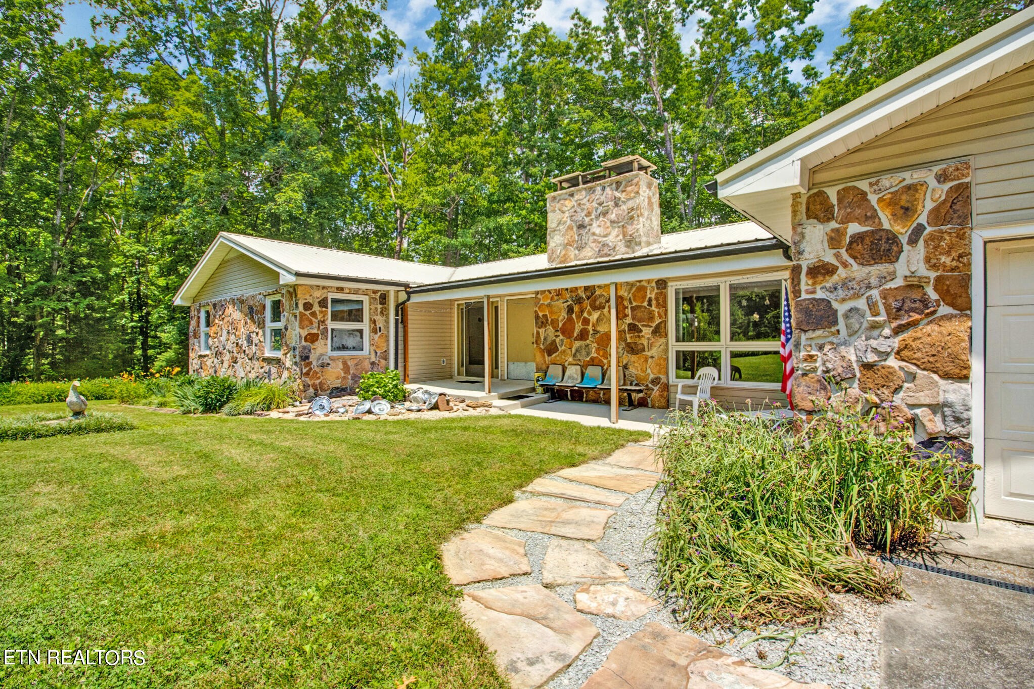 1620 Bell Road Crossville, TN 38571 - Photo 5 of 54 a front view of a house with garden