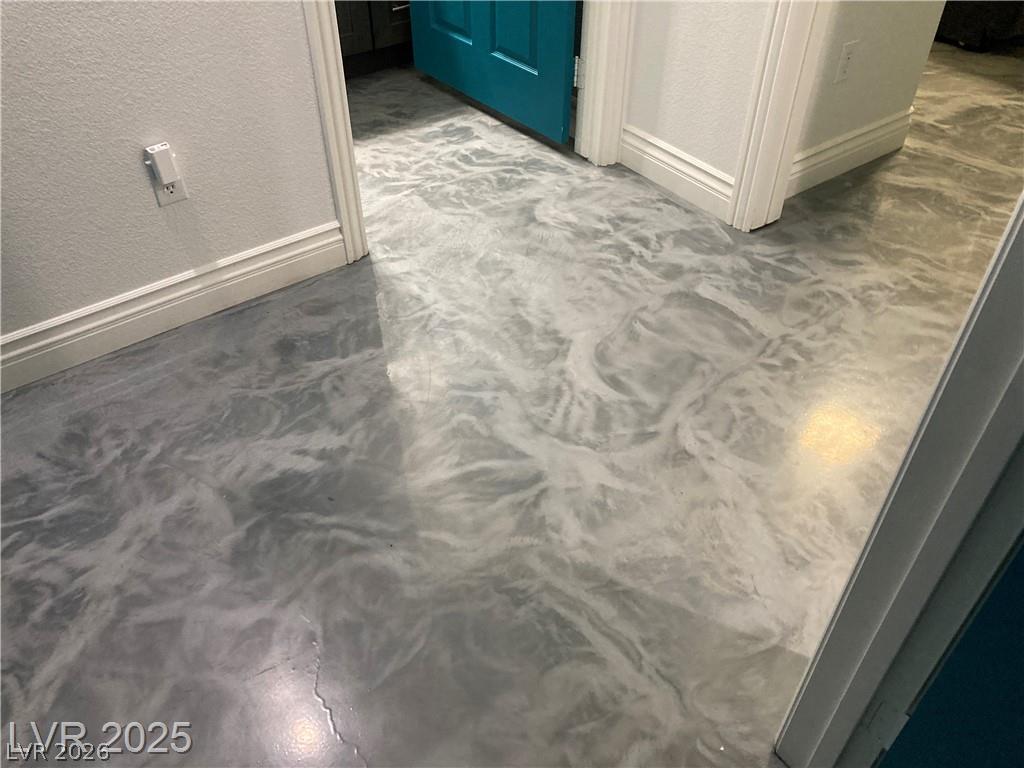 9050 West Warm Springs Road, Unit 1027 Las Vegas, NV 89148 - Photo 16 of 44 Fluid, artistic flooring adds a unique design element to the living space.