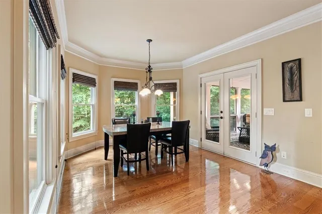 a bedroom with furniture and a flat screen tv