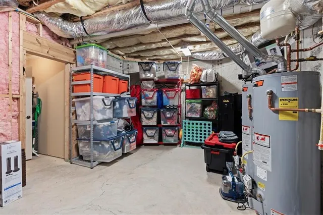 a front view of a house with a garden and trees