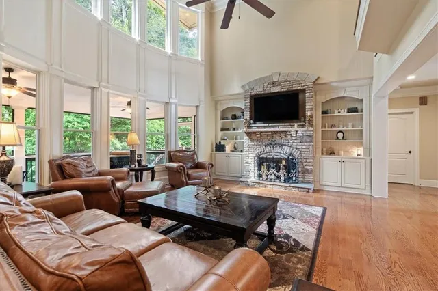 a living room with fireplace furniture and a flat screen tv