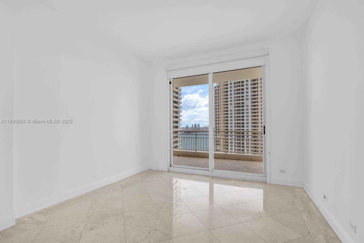 888 Brickell Key Drive, Unit 2607 Miami, FL 33131 - Photo 12 of 43 a view of an empty room with a window