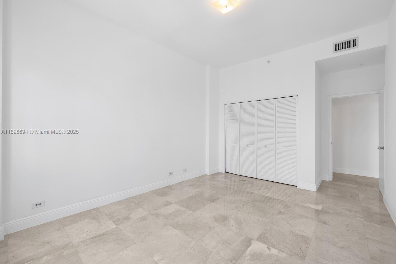 888 Brickell Key Drive, Unit 2607 Miami, FL 33131 - Photo 17 of 43 an empty room with an entryway