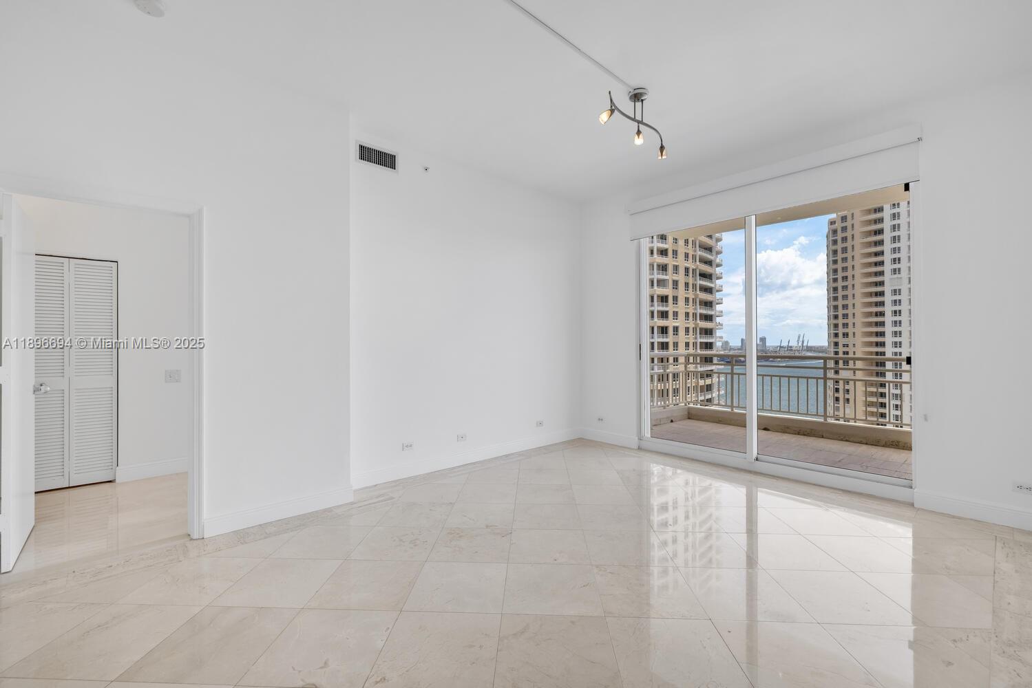 888 Brickell Key Drive, Unit 2607 Miami, FL 33131 - Photo 18 of 43 a view of an empty room with a window