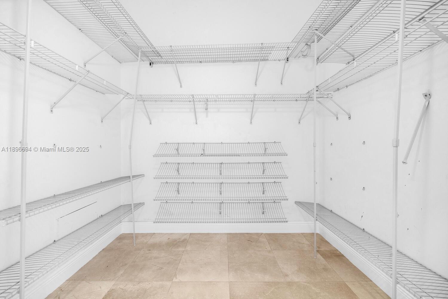 888 Brickell Key Drive, Unit 2607 Miami, FL 33131 - Photo 23 of 43 a view of walk in closet