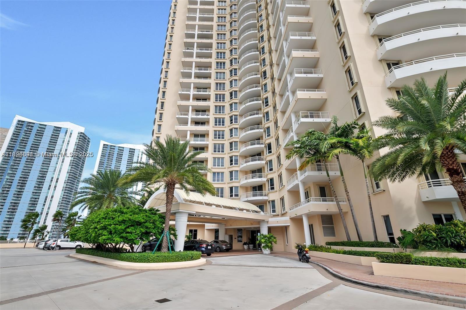 888 Brickell Key Drive, Unit 2607 Miami, FL 33131 - Photo 36 of 43 front view of a building with a street