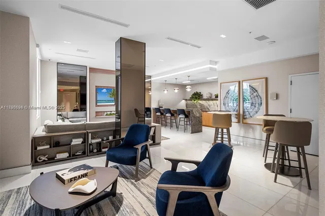 a living room with furniture potted plant and a large window