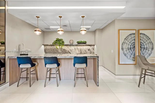 a very nice looking dining room with a table and chairs