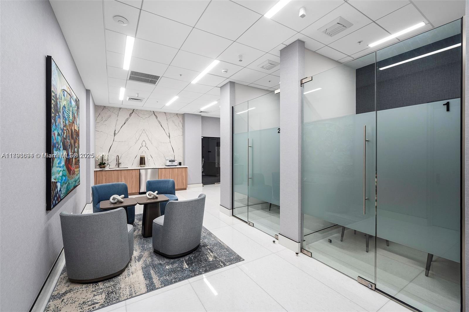 888 Brickell Key Drive, Unit 2607 Miami, FL 33131 - Photo 41 of 43 a dining room with glass door and chandelier