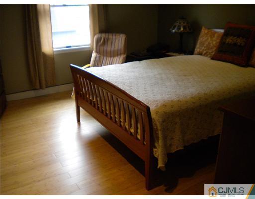 28 Purdue Road Old Bridge, NJ 08859 - Photo 13 of 25 a bedroom with bed and window