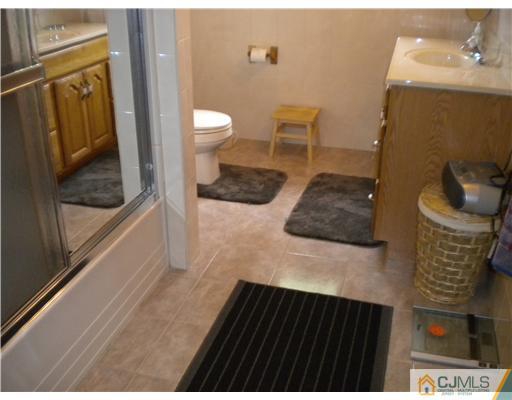 28 Purdue Road Old Bridge, NJ 08859 - Photo 18 of 25 a bathroom with a sink and a vanity