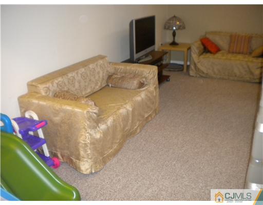 28 Purdue Road Old Bridge, NJ 08859 - Photo 21 of 25 a view of a couch in a room