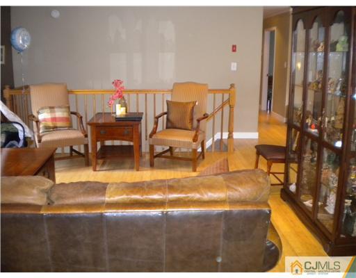 28 Purdue Road Old Bridge, NJ 08859 - Photo 4 of 25 a living room with couches and kitchen view with wooden floor