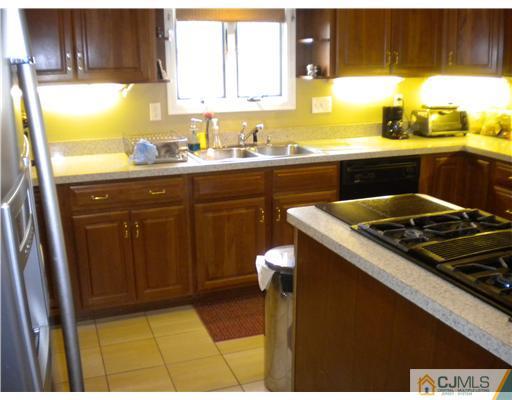 28 Purdue Road Old Bridge, NJ 08859 - Photo 9 of 25 a kitchen with a sink and cabinets
