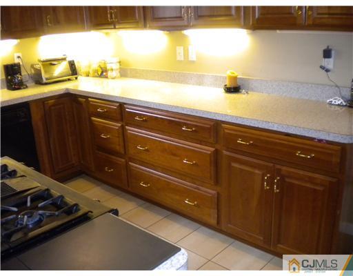 28 Purdue Road Old Bridge, NJ 08859 - Photo 10 of 25 a kitchen with a sink and cabinets