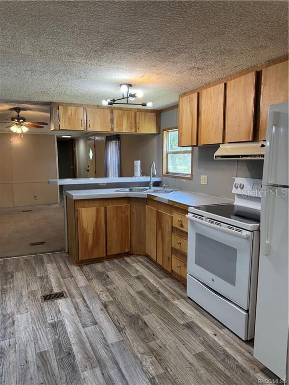 5590 Northwest 76th Avenue Chiefland, FL 32626 - Photo 3 of 22 a kitchen with a sink cabinets and appliances